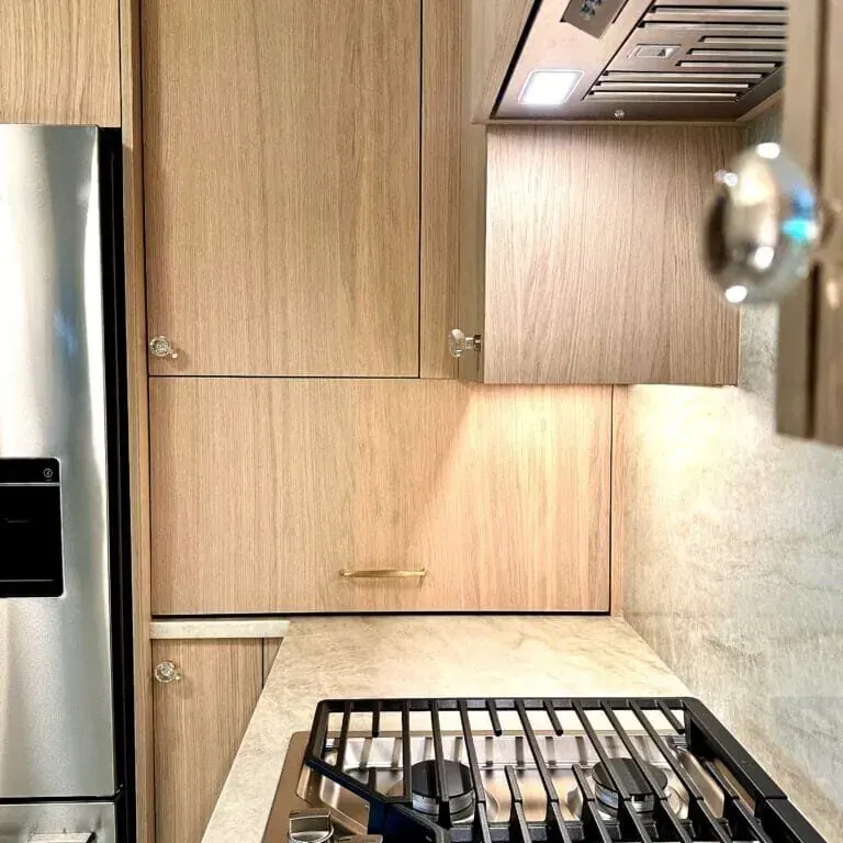 Light wood custom kitchen cabinets in a Scandinavian kitchen remodel by Timber Design + Build